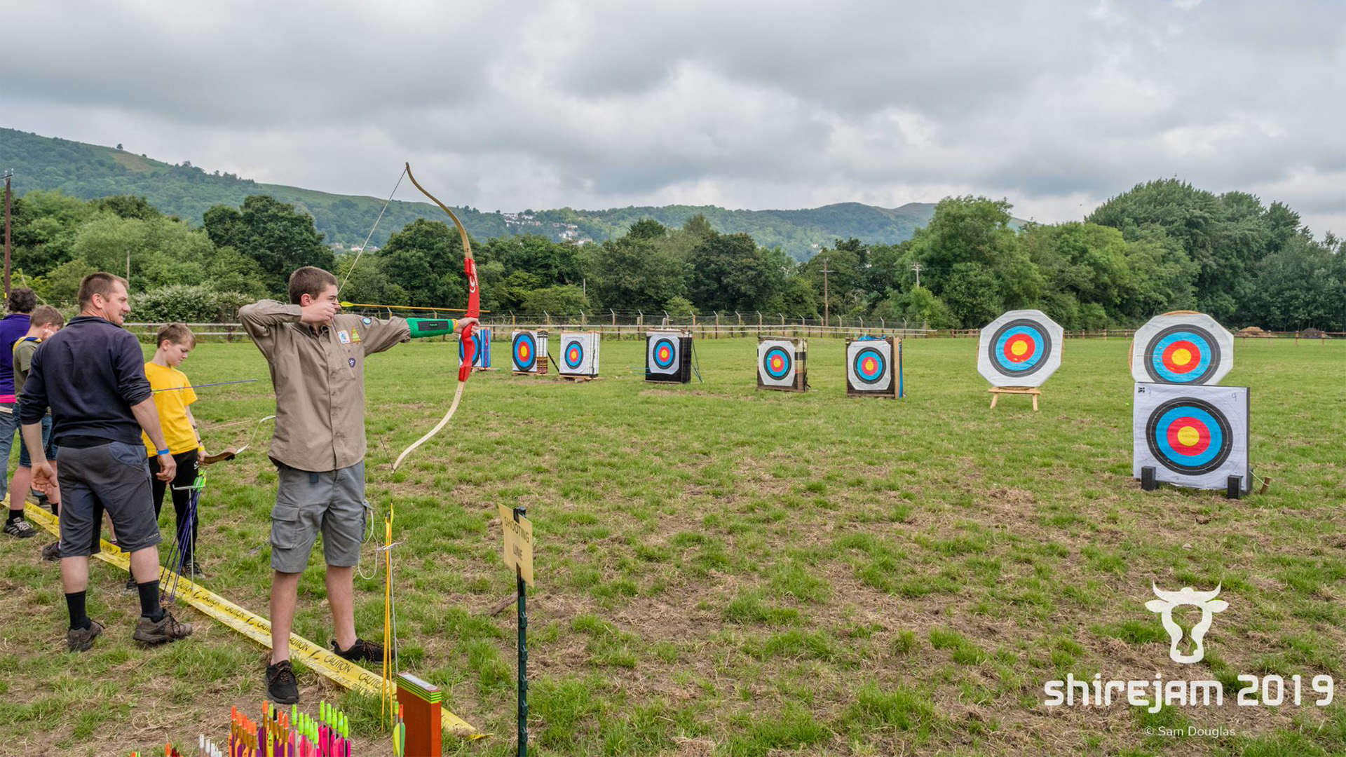 Image of scouts firing arrows at targets