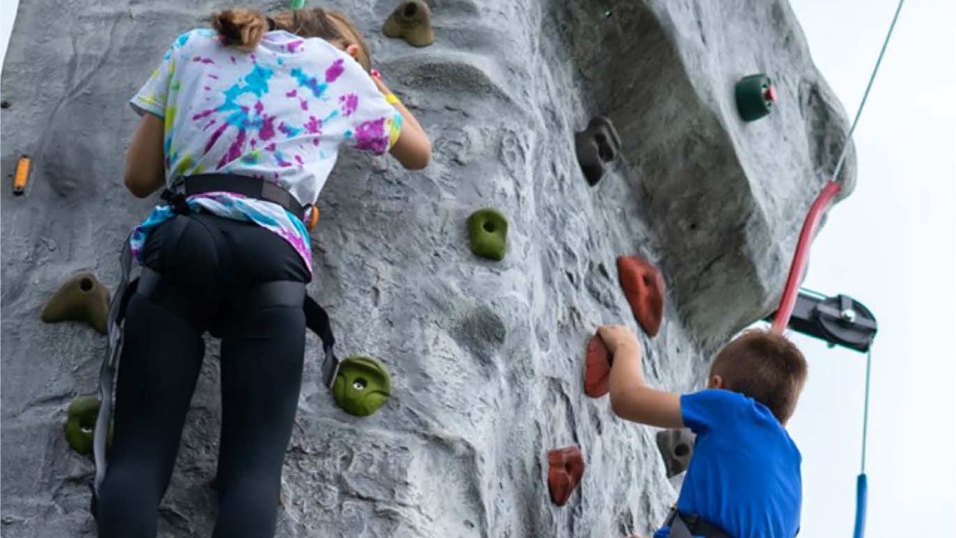 Image of two scouts doing rock climbing